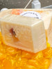 Hot Buttered Rum Shea Butter and Olive Oil Soap. Filled with orange suspension beads for easy exfoliating.